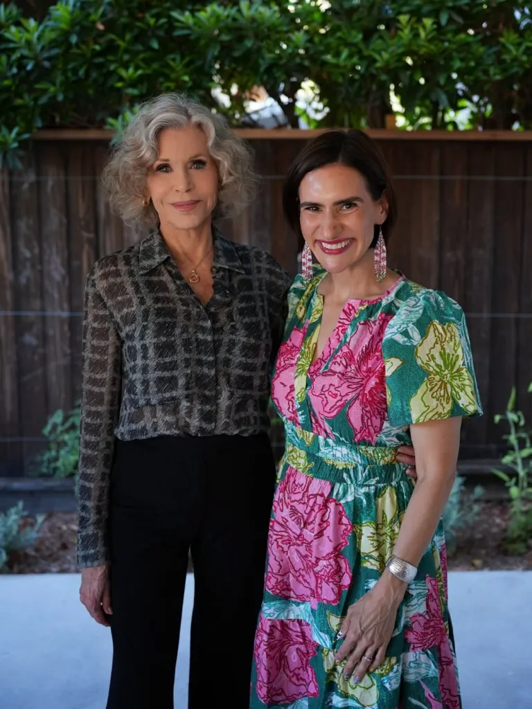 Jane Fonda and Peggy Flanagan standing together outdoors.