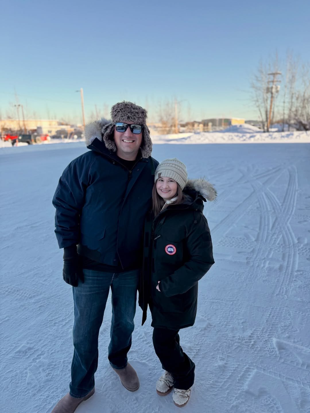 Gypsy Rose Blanchard and Ken Urker posing together in a snowy outdoor setting, both dressed in warm winter coats.