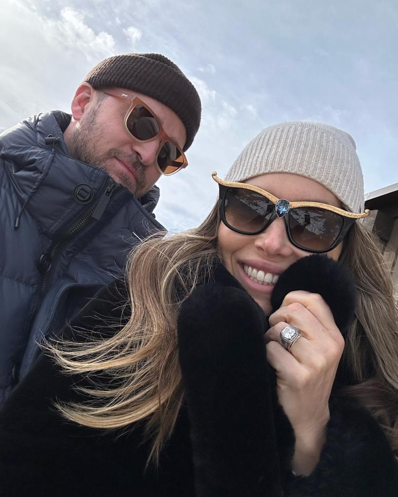 Justin Timberlake and Jessica Biel smiling outdoors in winter clothing.