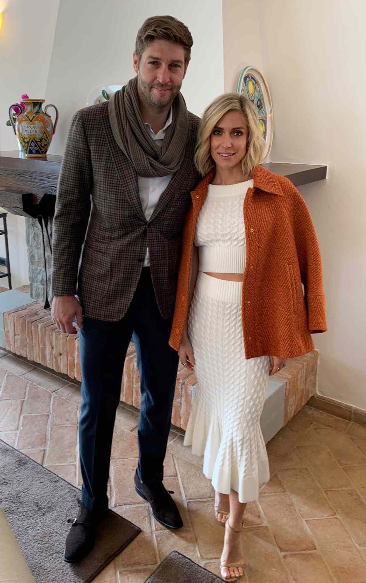 Kristin Cavallari and Jay Cutler pose together indoors.