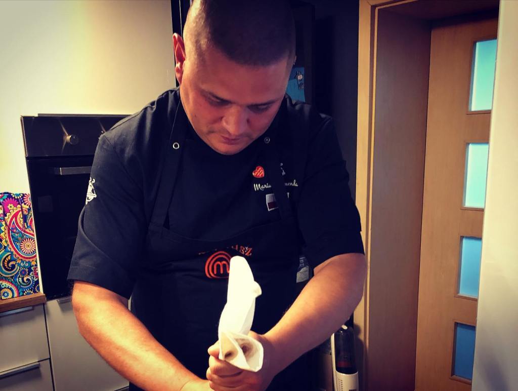 Polish MasterChef star Mariusz Bujak working in the kitchen.