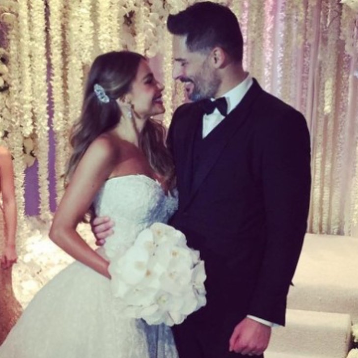 Wedding photo of Sofia Vergara and Joe Manganiello smiling at each other.