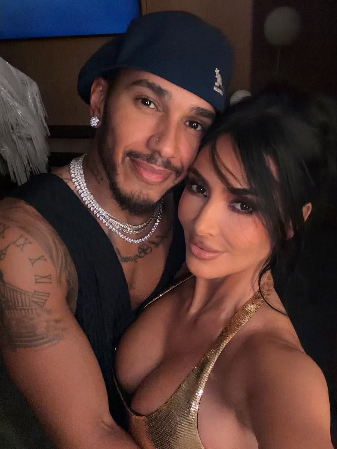Kim Kardashian and Lewis Hamilton pose together during a vacation in Paris.