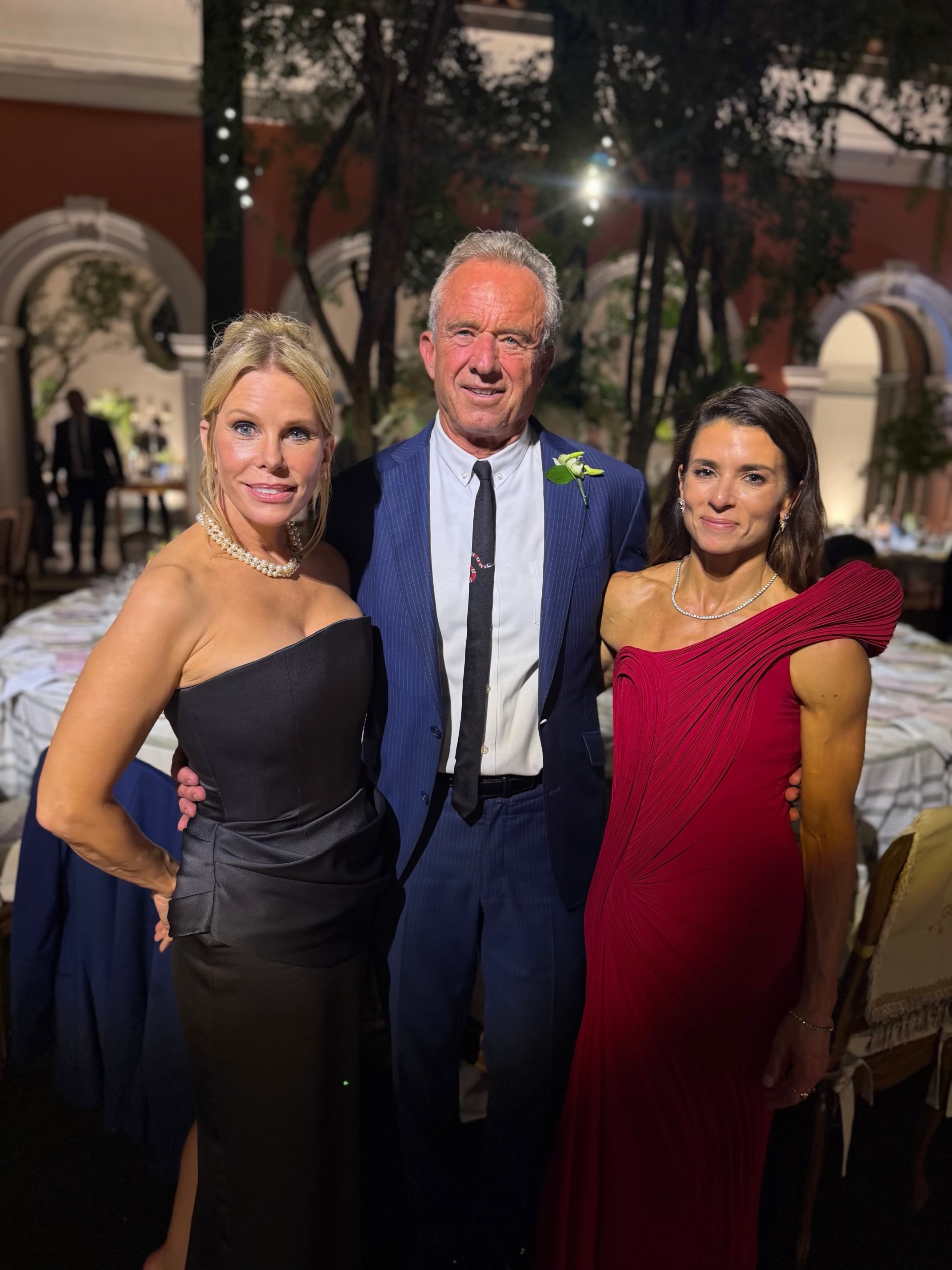 Robert F. Kennedy Jr. poses with wife Cheryl Hines and former NASCAR driver Danica Patrick.