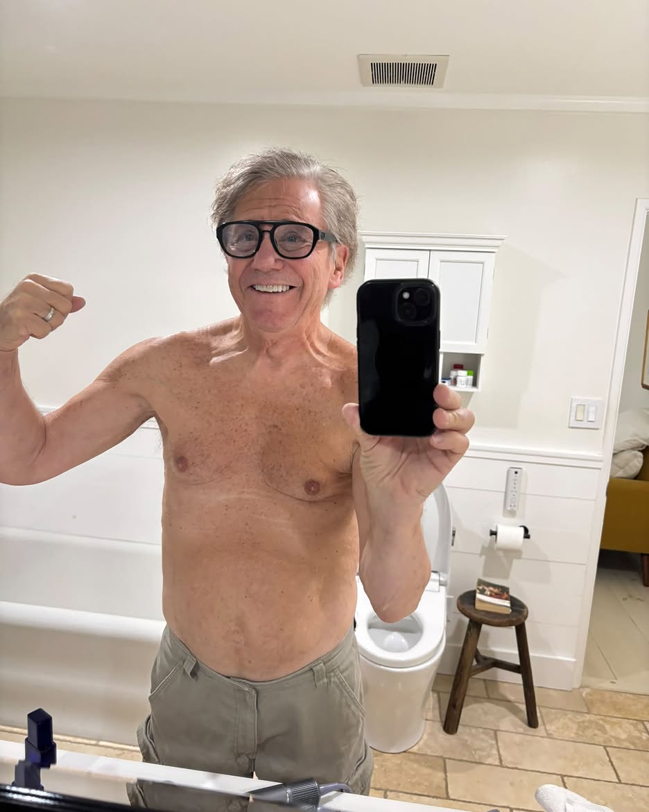 Shirtless selfie of Anson Williams in a bathroom.