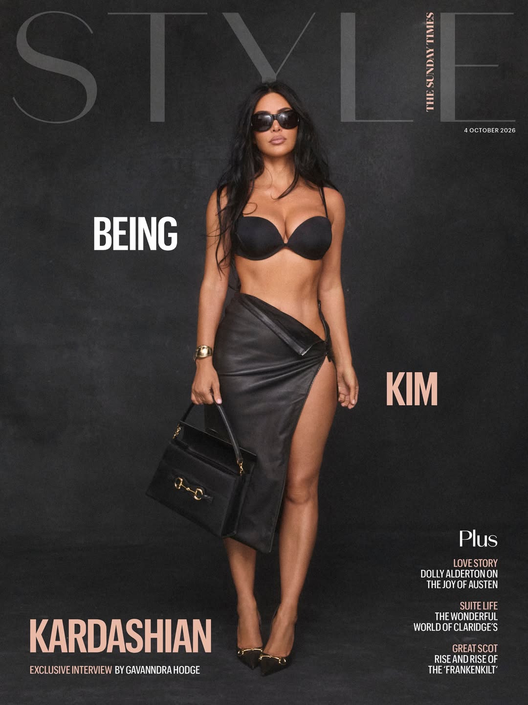Kim Kardashian on the cover of The Sunday Times Style magazine, wearing a black bra, asymmetrical leather skirt, sunglasses, and holding a black handbag.