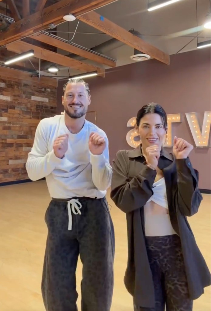 Val Chmerkovskiy and Jenna Dewan dancing in a dance studio.