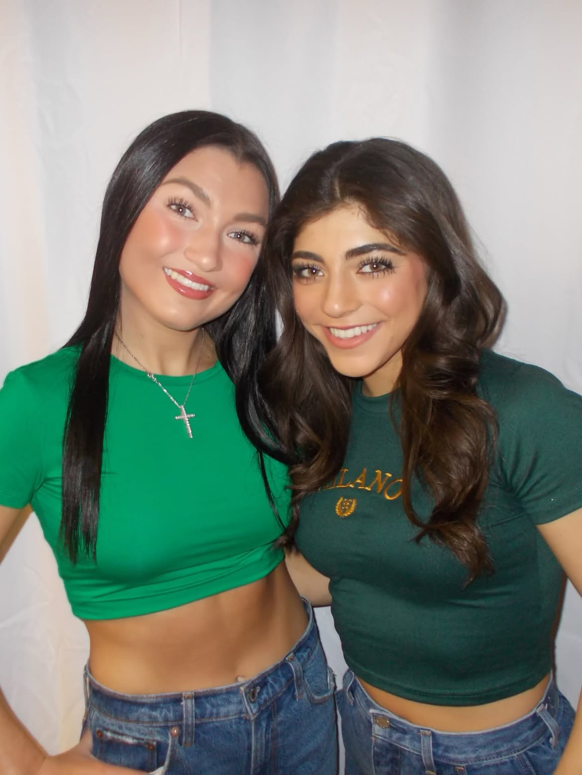 Milania and Gabriella Giudice pose together in matching green shirts.