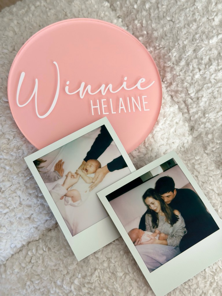 A pink circular sign reading 