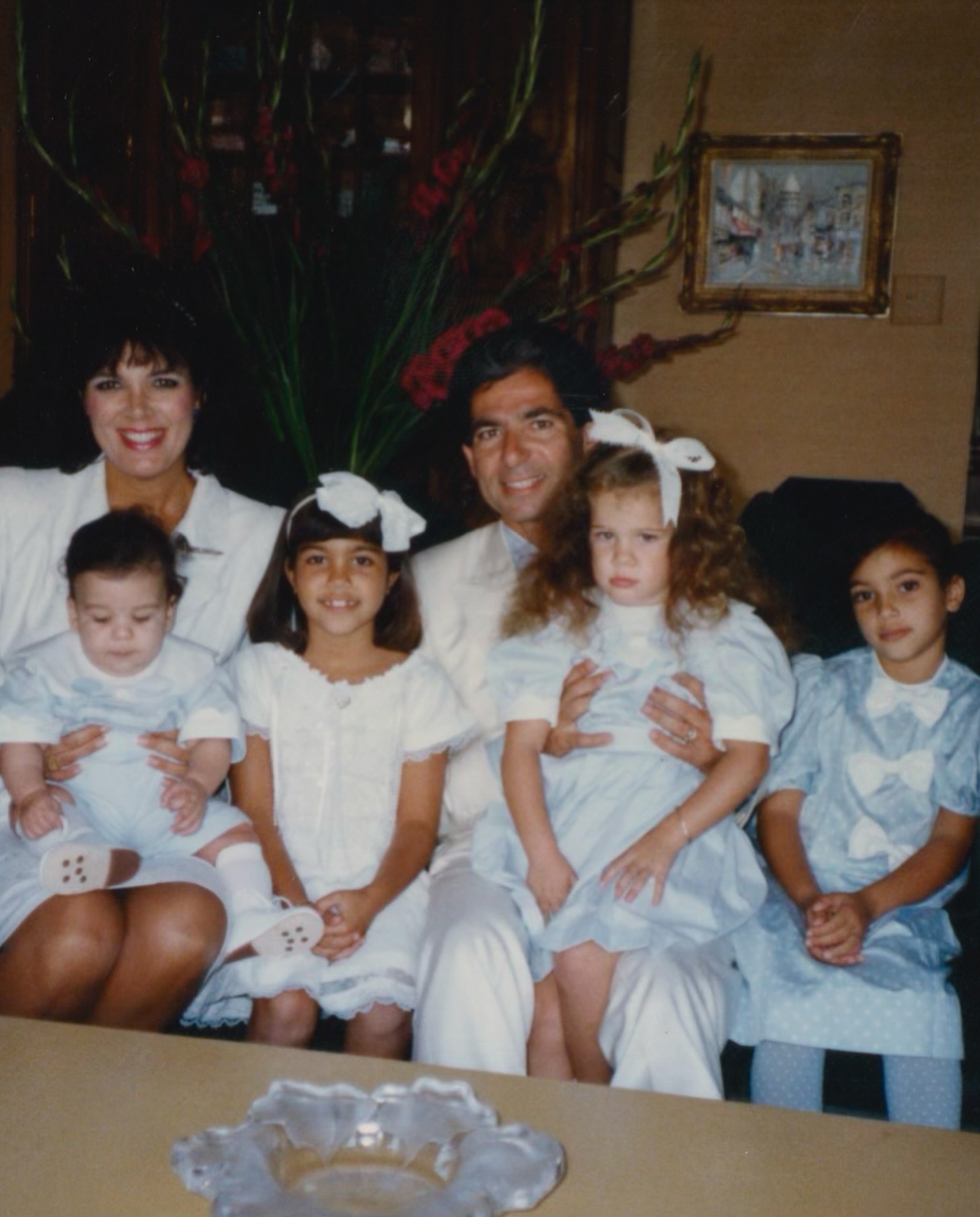Kris Jenner and Robert Kardashian pose with their children, including Kourtney, Kim, Khloe, and Rob.