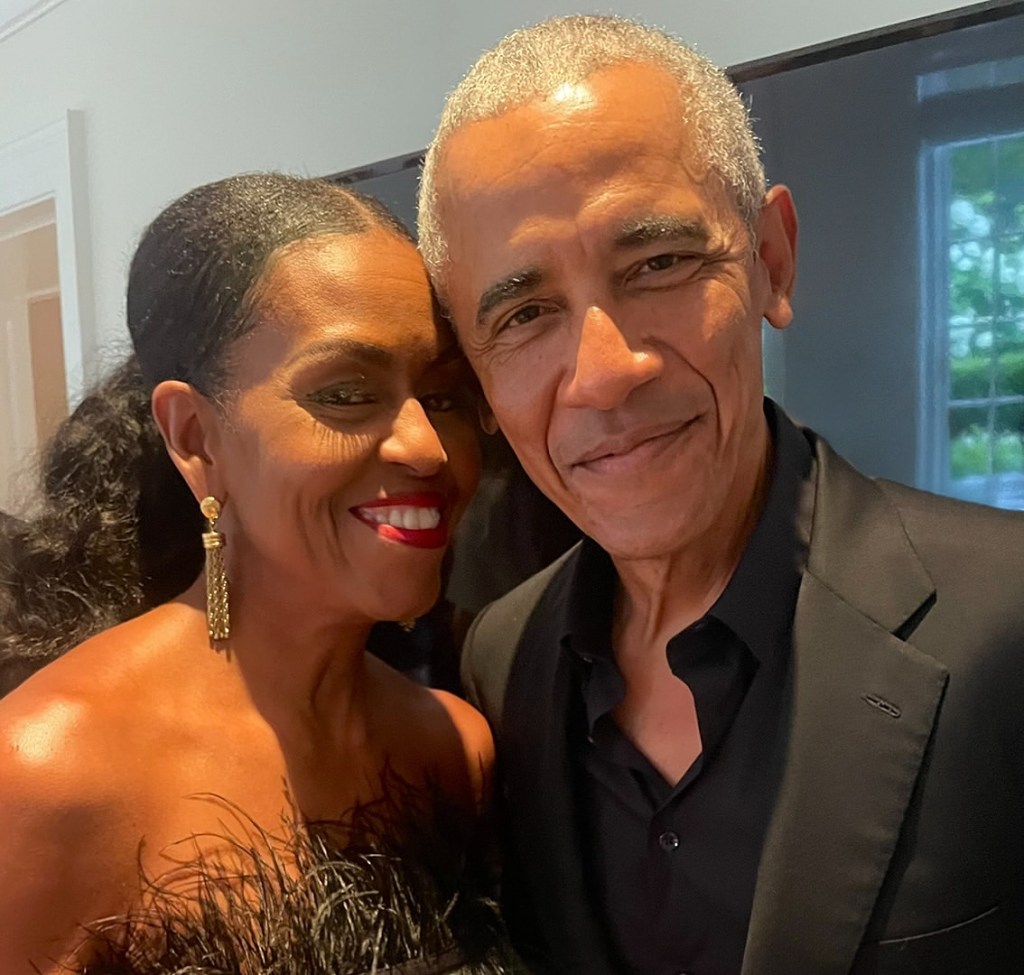 Michelle and Barack Obama posing together.