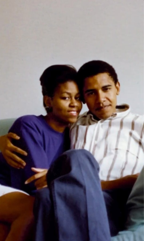 Barack and Michelle Obama sitting together on a couch.