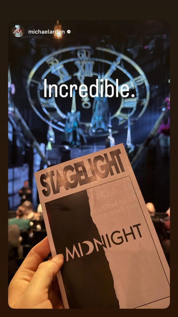 A person holding a playbill for