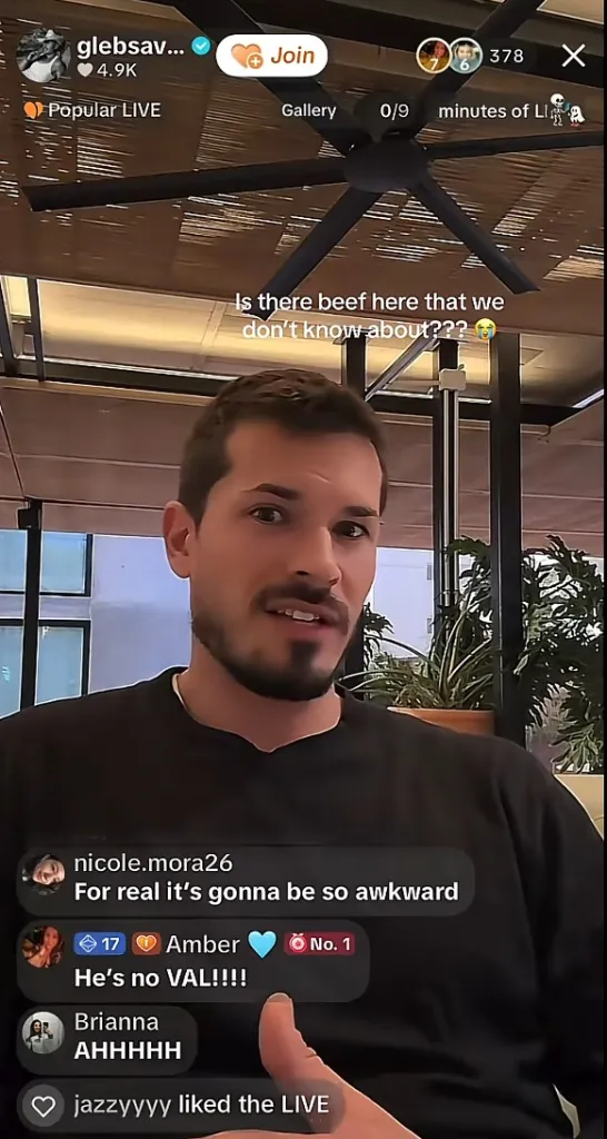 A screenshot of a live video featuring Gleb Savchenko speaking.