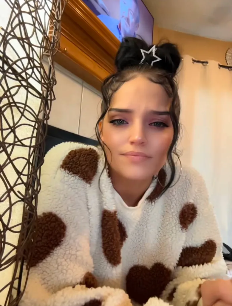 Autumn Urker wearing a fluffy cow-print sweater with a star hair accessory.