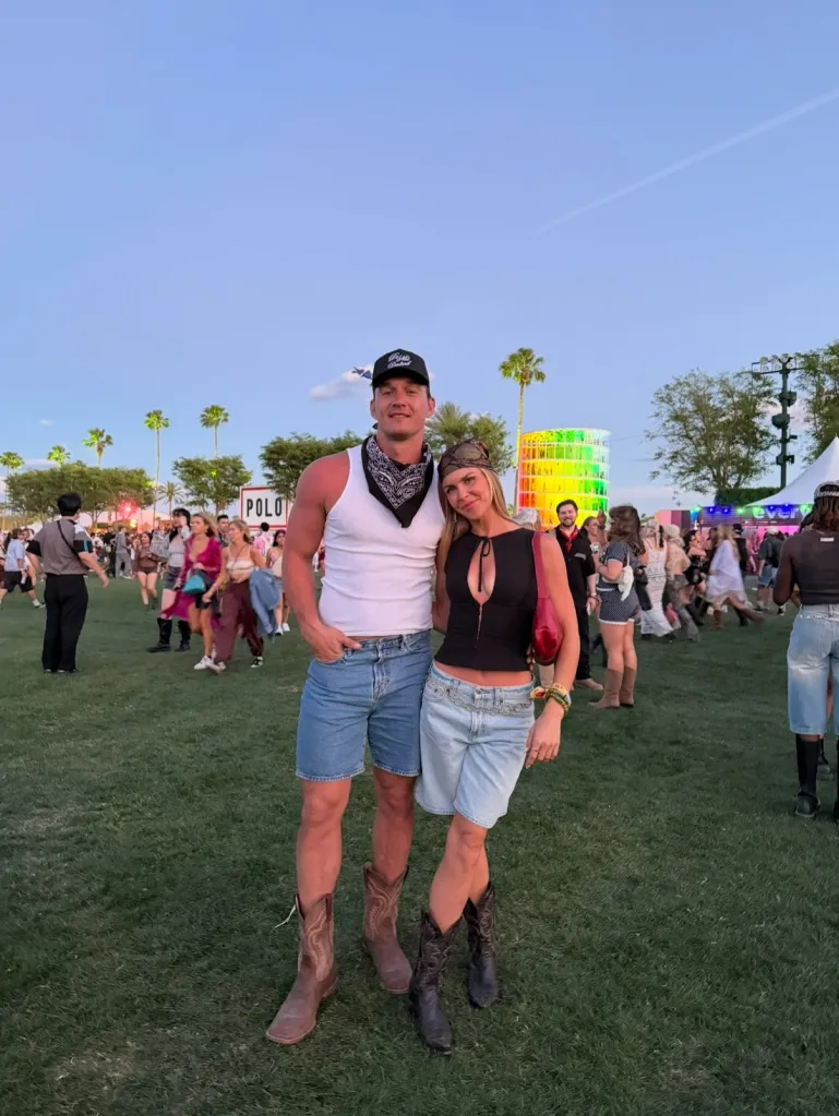 Tyler Cameron and fiancée Tate Madden pose together at an outdoor event.
