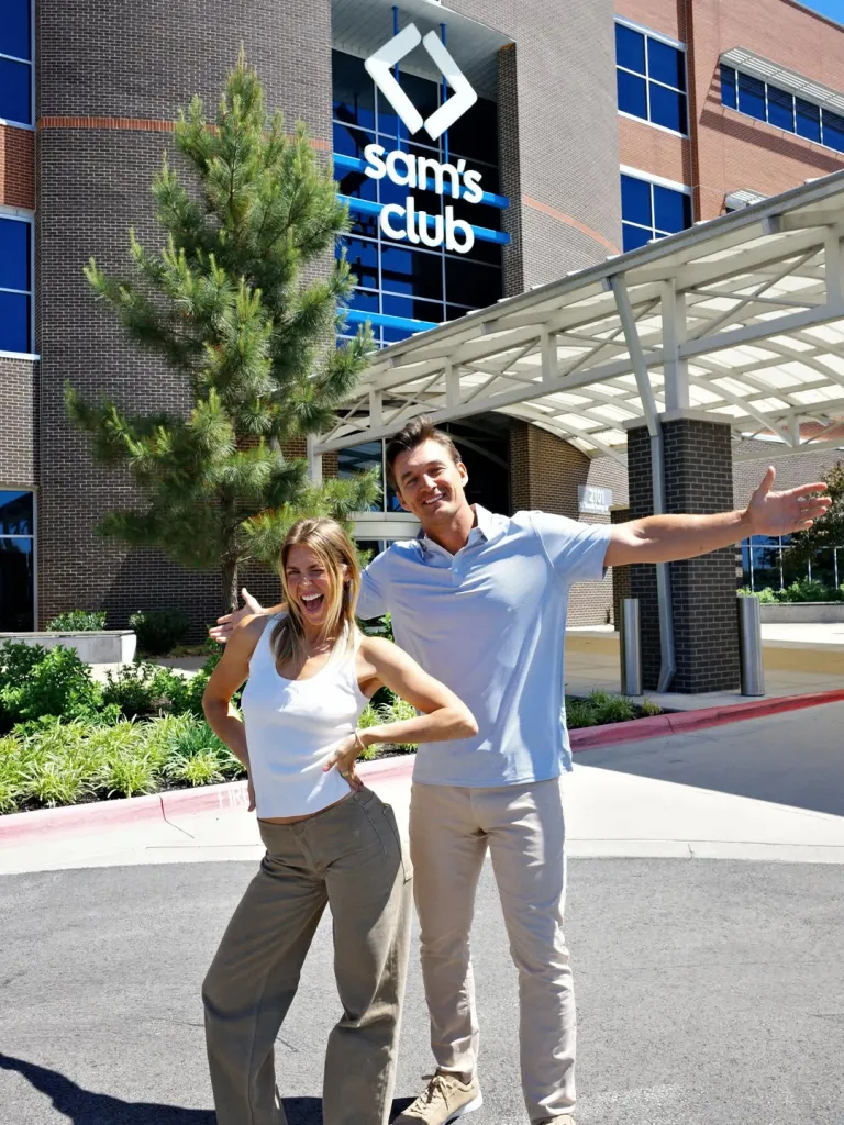 Tyler Cameron and fiancée Tate Madden pose outside a Sam's Club.